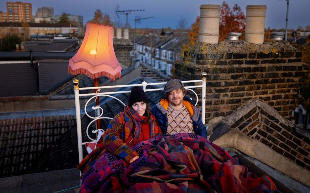 Dan Edelstyn and Hilary Powell sleeping on their roof for solar panels for the community-credit Peter Searle