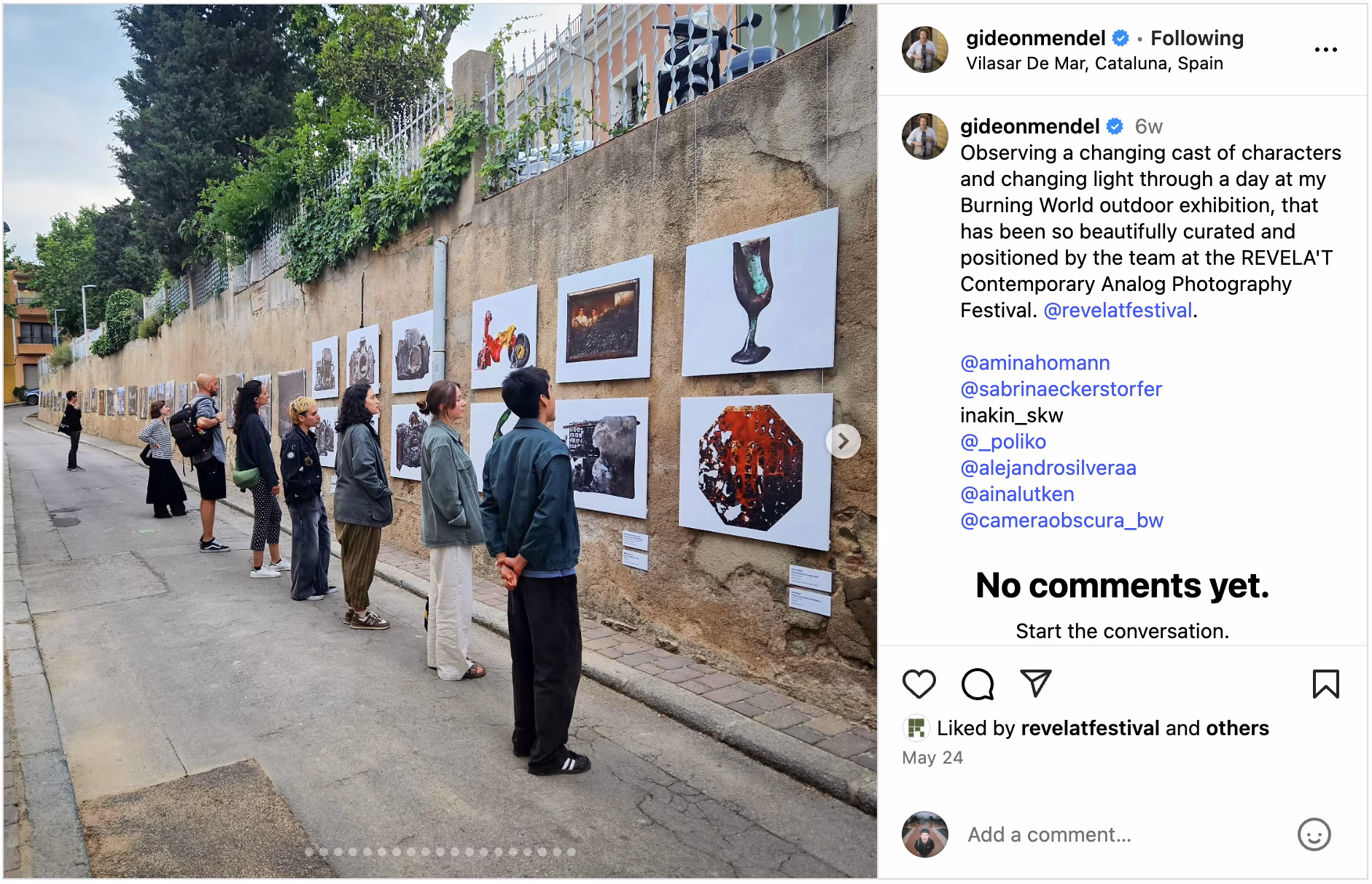 Images hanging outdoors on a concrete wall